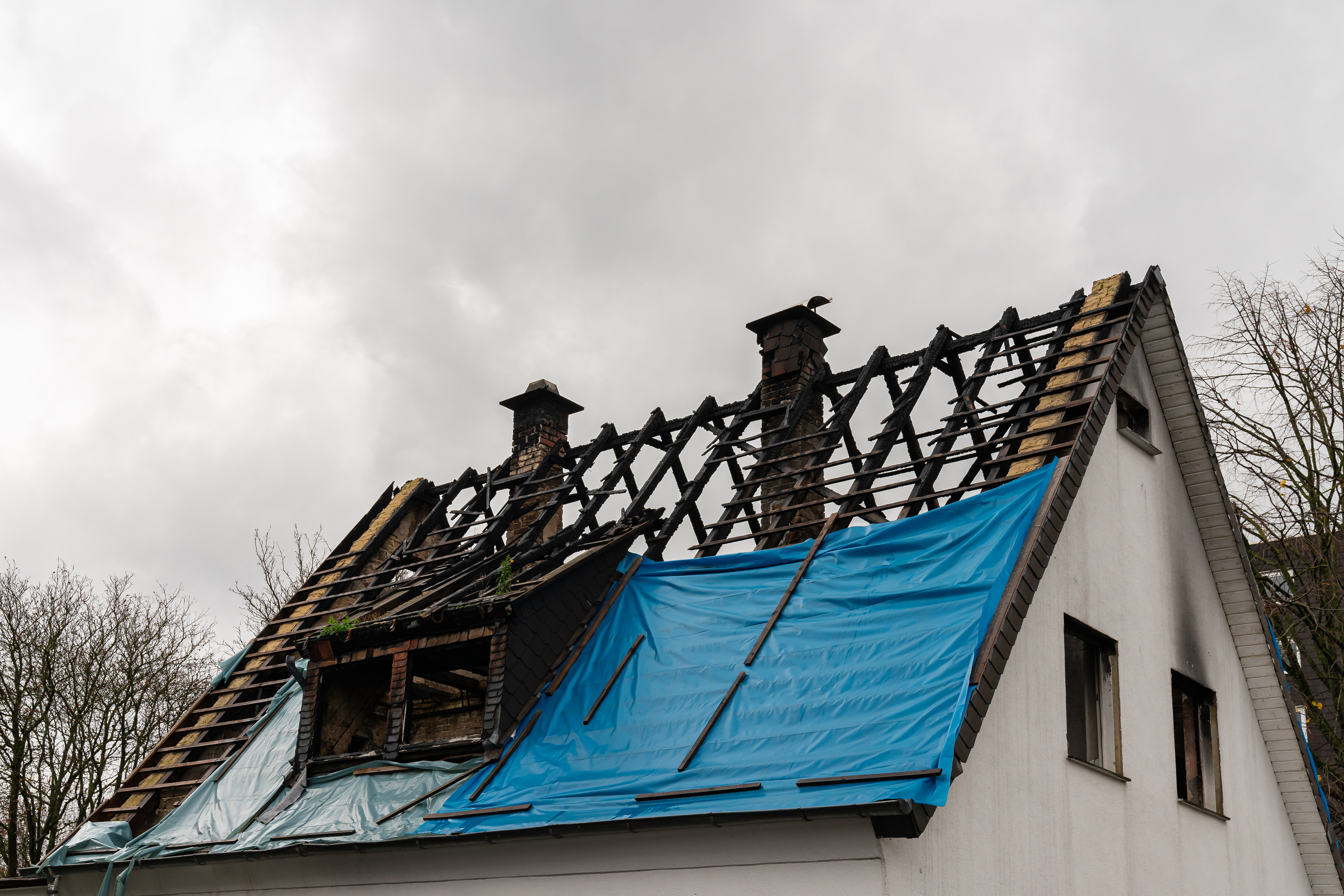 A burned down roof on a small building